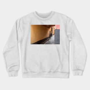 in a narrow alley you see a bike Crewneck Sweatshirt